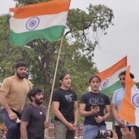 Wrestlers address the crowd at the candlelight march in Delhi in May 2023. (Photo: Surangya)