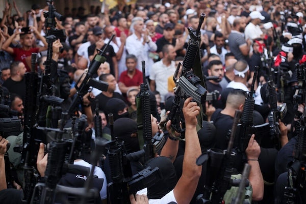 | MEMBERS OF THE PALESTINIAN RESISTANCE HOLD THEIR WEAPONS DURING A MEMORIAL SERVICE FOR MOHAMMED AL AZIZI AND ABDUL RAHMAN SOBH WHO WERE KILLED BY ISRAELI FORCES IN JULY 2022 IN THE WEST BANK CITY OF NABLUS PHOTO SHADI JARARAH APA IMAGES | MR Online