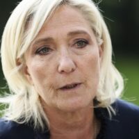 French far-right leader Marine Le Pen answers reporters at the Elysee Palace after a meeting with French President Emmanuel Macron who is holding talks with key political players in a bid to form a new government, August 26, 2024 in Paris