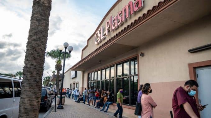 | People wait in line outside CSL Plasma on May 25 2021 in Brownsville Texas | MR Online