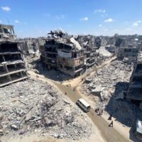  | PEOPLE MAKE THEIR WAY AMID THE RUBBLE OF BUILDINGS DESTROYED DURING ISRAELI BOMBARDMENT OF THE THE JABALIA REFUGEE ON AUGUST 31 2024 PHOTO HADI DAOUD  APA IMAGES | MR Online