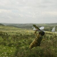 An IDF soldier prepares to launch a Skylark drone manufactured by Elbit Systems, an Israel-based international military technology company and defense contractor. Photo courtesy the Israel Defense Forces/Flickr.