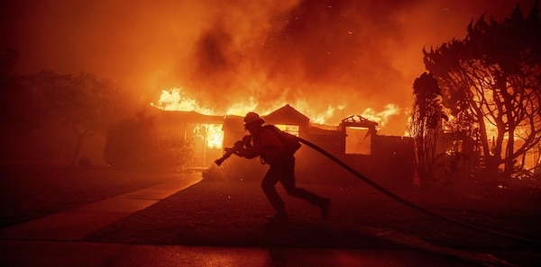 | A firefighter battles the Palisades Fire as it burns a structure in the Pacific Palisades neighbourhood of Los Angeles January 7 2025 | MR Online