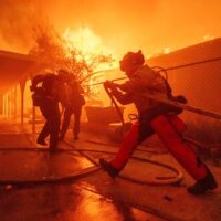  | Firefighters protect a structure as the Eaton Fire advances Wednesday January 8 2025 in Altadena California AP PhotoEthan Swope | MR Online