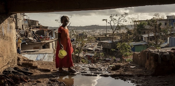 | A young girl walks in the Kaweni slum on the outskirts of Mamoudzou in the French Indian Ocean island of Mayotte December 19 2024 after Cyclone Chido | MR Online