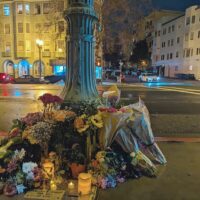 Michael Burawoy died on Grand Avenue this week after being hit by a driver. Within hours of his death, a flower memorial popped up in his honor, with many of his former students stopping by. Credit: Bryan Culbertson