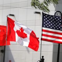 Flags of the U.S., Canada and Mexico fly next to each other in Detroit, Michigan, U.S. August 29, 2018. REUTERS/Rebecca Cook/File Photo