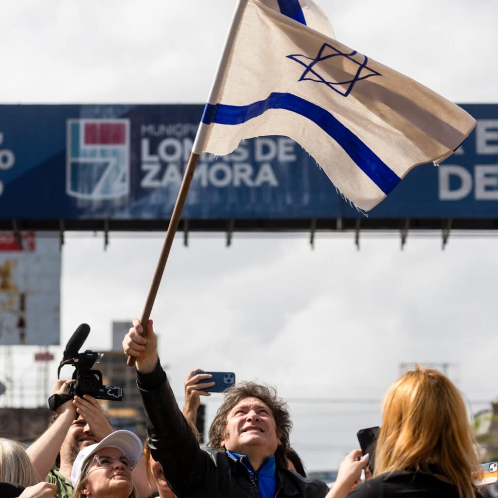 Javier Milei gazes upwards towards an Israeli flag during a rally in Argentina Photo | AP