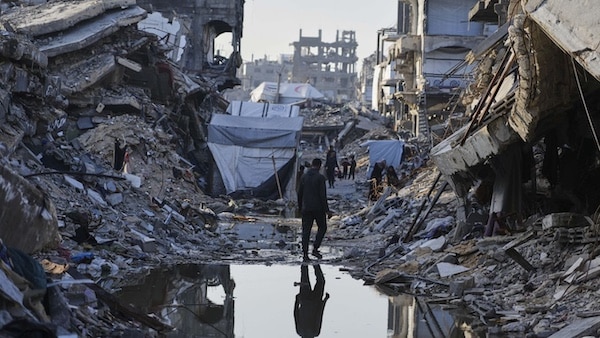  | Palestinians walk amid the rubble of destroyed homes and buildings in Jabaliya northern Gaza Strip on Friday March 14 2025 AP PhotoJehad Alshrafi | MR Online