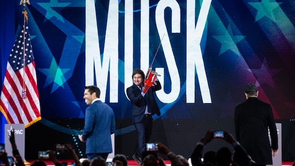  | President of Argentina Javier Milei arrives on stage with a custom chainsaw before Elon Musk and Nesmax Host Rob Schmitt before speak during day 1 of the 2025 Conservative Political Action Conference February 20 2025 Graeme Sloan | AP | MR Online