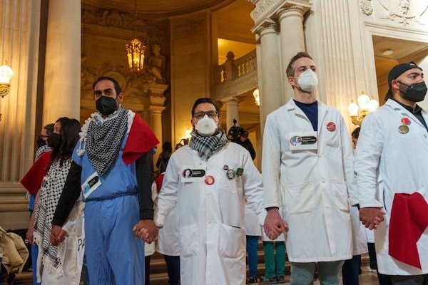 MR Online | Healthcare workers hold a vigil at San Francisco City Hall to honor the healthcare workers who have been killed in Gaza Photo John Avalos | MR Online