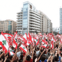 Caption: A sea of Lebanese flags carried by demonstrators in 2019. Liberation News