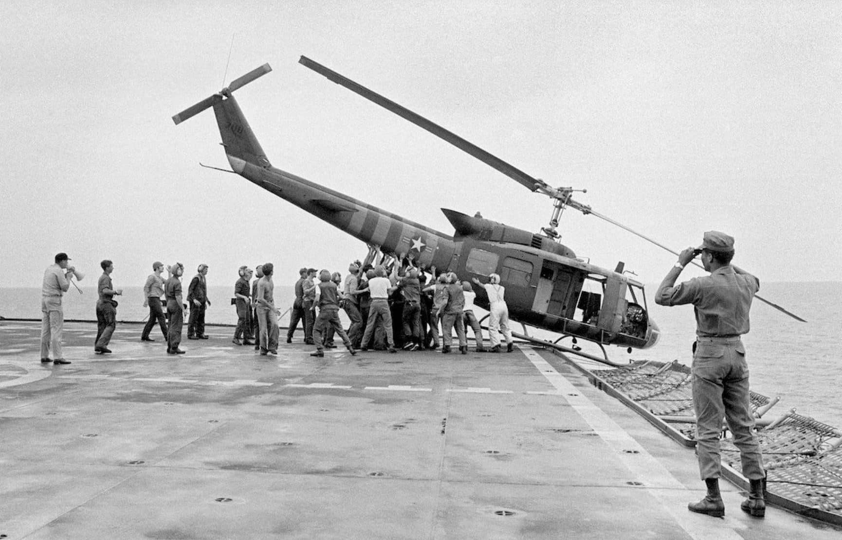 MR Online | Iroquois helicopter pushed overboard from the USS Blue Ridge during the evacuation of Saigon April 29 1975 | MR Online