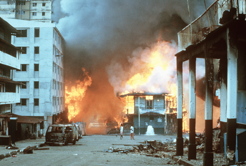 Screenshot 20250518 at 115343 AM | MR Online Flames engulf a building following hostilities between the Panamanian Defense Force and US forces during Operation Just Cause Dec 21 1989 Morland DoD Wikimedia Commons Public Domain