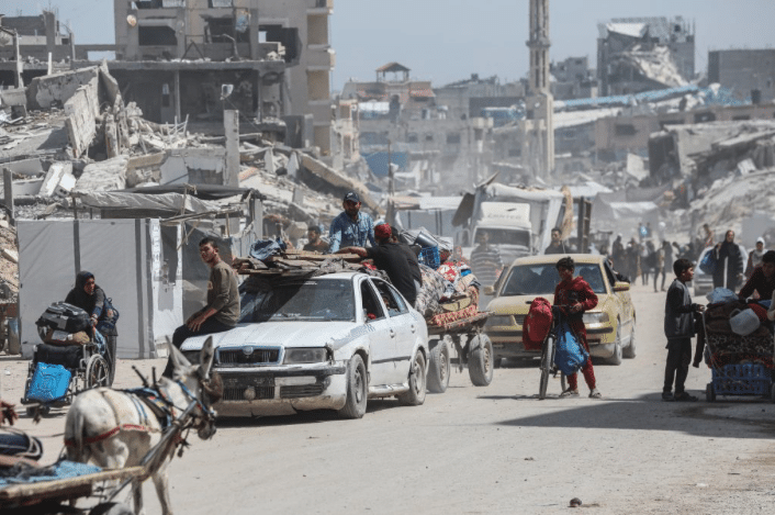 Screenshot 20250519 at 92431 AM | MR Online PALESTINIANS CARRY THEIR BELONGINGS AS THEY FLEE GAZA CITY ON MAY 16 2025 PHOTO OMAR ASHTAWYAPA IMAGES