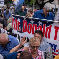 White South Africans rallying in support of President Trump outside the U.S. Embassy in Pretoria, South Africa, last month. Photo; Joao Silva/The New York Times