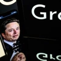 An image of the Grok logo, a generative artificial intelligence chatbot developed by xAI, and it's founder, South African businessman Elon Musk, in Toulouse, France, on 13 January 2025 (Lionel Bonaventure/AFP)