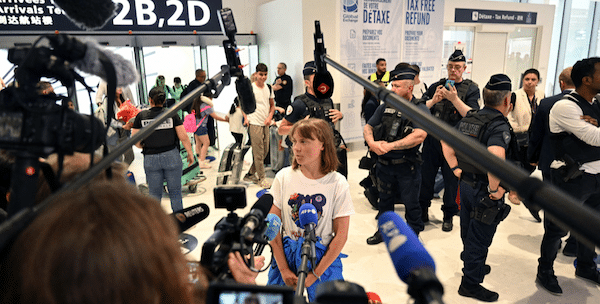MR Online | Swedish campaigner Greta Thunberg talks to journalists upon arrival at Roissy Charles de Gaulle Airport as she left the occupied territories on a flight to Sweden via France after she was detained along with other activists aboard a Gaza bound aid boat June 10 2025 Photo by AFP | MR Online