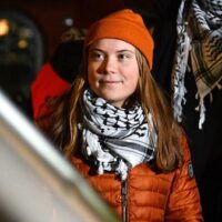 Activist Greta Thunberg stands near the stage during a pro-Palestinian demonstration in Mannheim, Germany, on Dec. 6, 2024. Uwe Anspach | AP