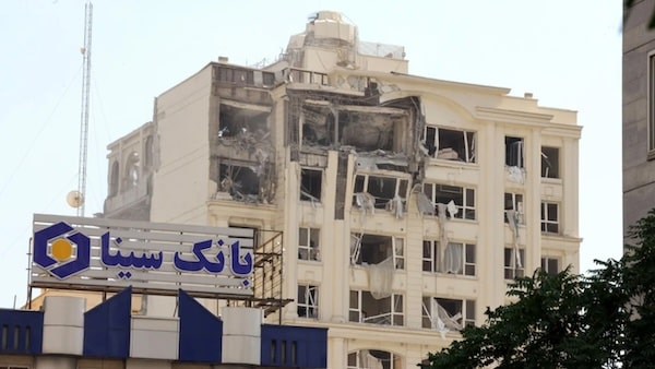 MR Online | A building damaged in an Israeli strike on Tehran on 13 June 2025 Atta KennerAFP | MR Online