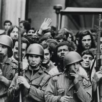 Soldiers with citizens following the overthrow of the government on 25 April 1974 in Lisbon, Portugal CREDIT: Alfredo Cunha