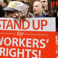 Billionaires and far-right politicians have teamed up to wage a 'global war on labor rights,' according to the latest Global Rights Index from the International Trade Union Confederation. | Tony Dejak / AP