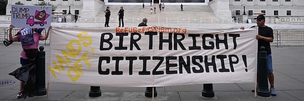  | Demonstrators hold up signs opposing President Donald Trump and his attack on birthright citizenship outside the US Supreme Court in Washington DC on June 27 2025 Photo Alex WroblewskiAFP via Getty Images | MR Online