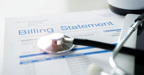  | Health care billing statement with stethoscope bottle of medicine for doctors work in medical center stone background | MR Online