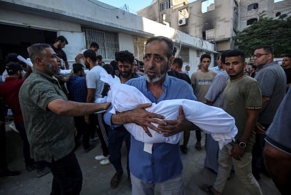 MR Online | A PALESTINIAN MAN CARRIES THE BODY OF A BABY KILLED IN AN ISRAELI ATTACK ON AL SHATI CAMP AT THE MORGUE OF AL SHIFA HOSPITAL IN GAZA CITY GAZA ON JULY 9 2025 PHOTO OMAR ASHTAWYAPA IMAGES | MR Online