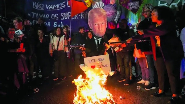 MR Online | Protesters in Brazil burned an effigy of Donald Trump as they gathered to condemn 50 US tariffs announced for Brazilian goods which Trump has linked to the coup trial of his political ally former Brazilian President Jair Bolsonaro | MR Online