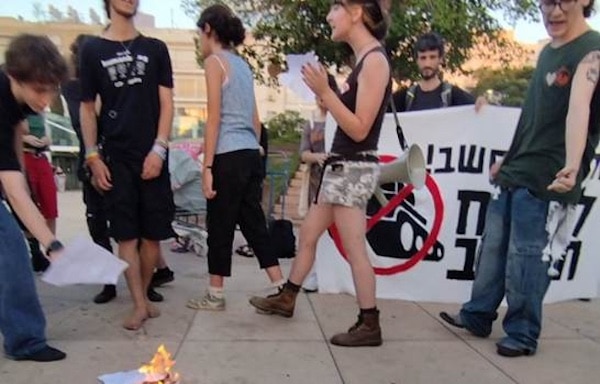  | Israeli teenagers burning draft orders at Habima Square in Central Tel Aviv on last Tuesday July 15 2025 Photo Zo Haderekh | MR Online
