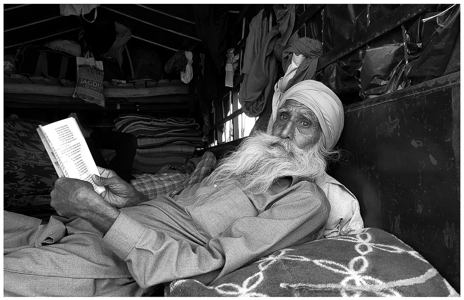 A farmer who joined in the initial protest reads work by the revolutionary Punjabi poet Pash in his trolly at the Singhu border in Delhi 10 December 2021Vikas Thakur  Tricontinental Institute for Social Research