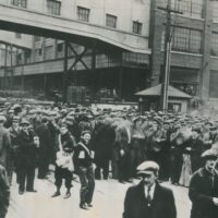 A large crowd gathers outside the General Motors plant in Oshawa, April 9, 1937. The strike was a key moment in the fight for industrial unionism in Canada and a significant event in the history of the United Automobile Workers (UAW). Photo courtesy the Oshawa Museum.