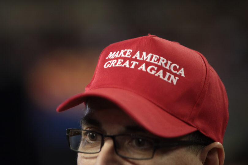  | A man wearing a Make America Great Again hat Only the upper half of his face is visible | MR Online