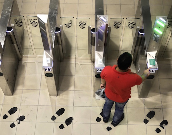 A Palestinian man passes through a biometric gate at the Qalandia crossing near Jerusalem. Sebastian Scheiner | AP
