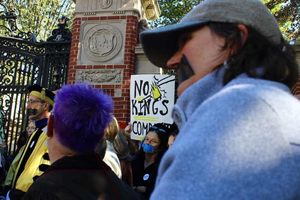 Demonstrators at Brown University taped their mouths shut to emphasize how they believe the compact would have a chilling effect on free speech. Students and faculty at all nine institutions that initially received the compact have protested it, as have thousands of other students across the country. | Photo by Jake Parker