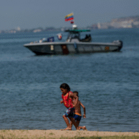 Children play on the beach during a security deployment in Anzoátegui, Venezuela, 19 September 2025. Credit: Rosana Silva R.