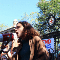 Caitlyn Carpenter, a senior at Brown University, was one of hundreds to protest Oct. 9 against demands from the Trump administration to restrict speech opposing conservatives. | Photo by Jake Parker