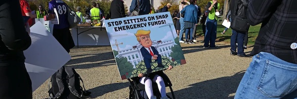 People attend the People’s Pantry Food drive to replenish food banks ahead of the Supplemental Nutrition Assistance Program (SNAP) lapse at the USDA Headquarters, on the National Mall, Washington, DC, on October 30, 2025. (Photo by Oliver Contreras/AFP)
