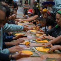 Venezuelans preparing Hallacas, a beloved Christmas tradition made together across generations. Photo Federico PARRA / AFP