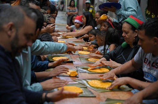 Venezuelans preparing Hallacas, a beloved Christmas tradition made together across generations. Photo Federico PARRA / AFP