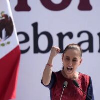 Mexican President Claudia Sheinbaum addresses supporters gathered in the Zocalo in Mexico City, December 6, 2025, to celebrate the seven years since President Andres Manuel Lopez Obrador electoral victory