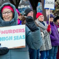 People take part in a national day of protest against US policy on Venezuela in Brattleboro, Vermont, , December 6, 2025