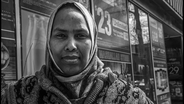 MR Online   Fozia Guirreh a Somali Bantu woman on Main Street where Somali stores have taken the place of boarded up storefronts| David Bacon   MR Online