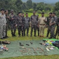 Security personnel with the arms, ammunition and other items recovered from Maoists during a gunfight, in Hazaribag district, Jharkhand, Monday, Sept. 15, 2025. At least three Maoists were killed in the gunfight. Photo: PTI