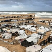 A displacement camp sheltering Palestinians on a beach amid stormy weather is seen in Gaza City, Jan. 13, 2026. (Photo: Ap Photo/Jehad Alshrafi)