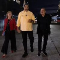 First Lady Cilia Flores (L), President Nicolas Maduro (C) and journalist Ignacio Ramonet (R) in Caracas, Venezuela.
