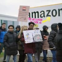 PERFECTLY ILLUSTRATED: Unionised GMB workers rally outside the Amazon fulfilment centre in Coventry during a strike in January 2023