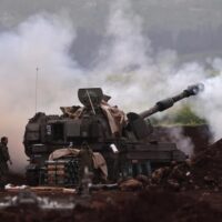 ​An Israeli artillery unit deployed at an undisclosed location at the Israeli border with Lebanon shells targets in Lebanon, 14 March 2026. Photo: EFE/EPA/ATEF SAFADI