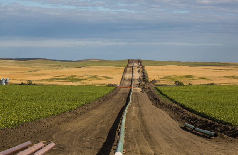 A wide view of the Dakota Access Pipeline extending to the horizon, with expanses of prairie on either side.